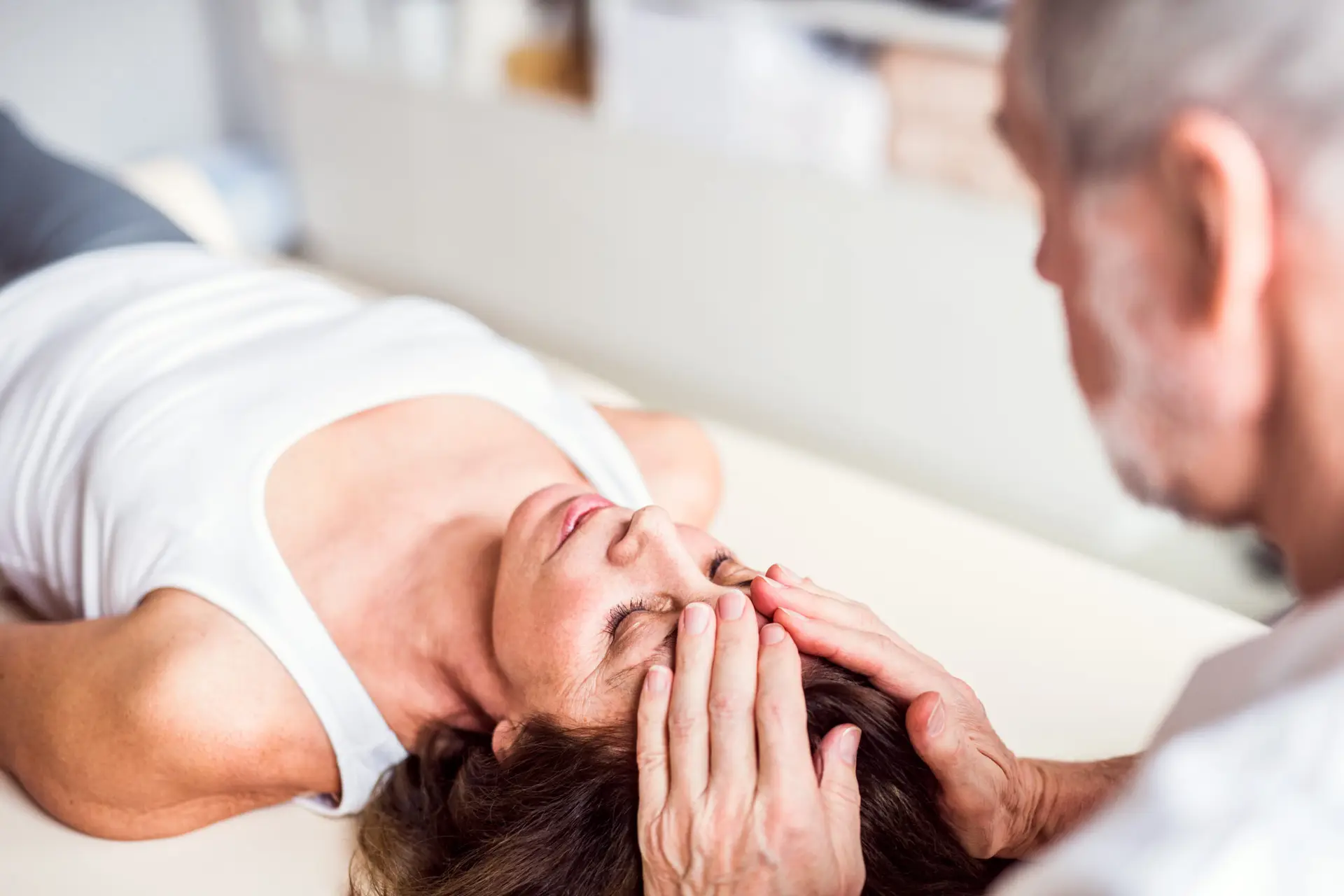 Physiotherapist treating female patient